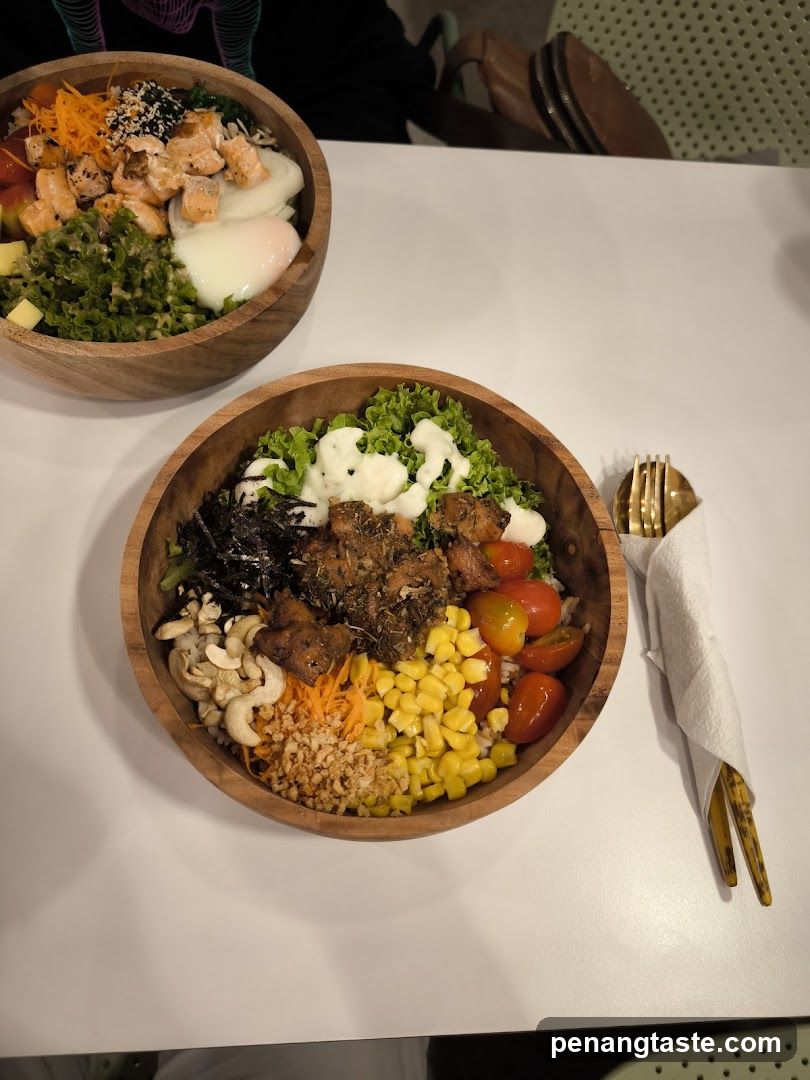 Two poke bowls on a white table