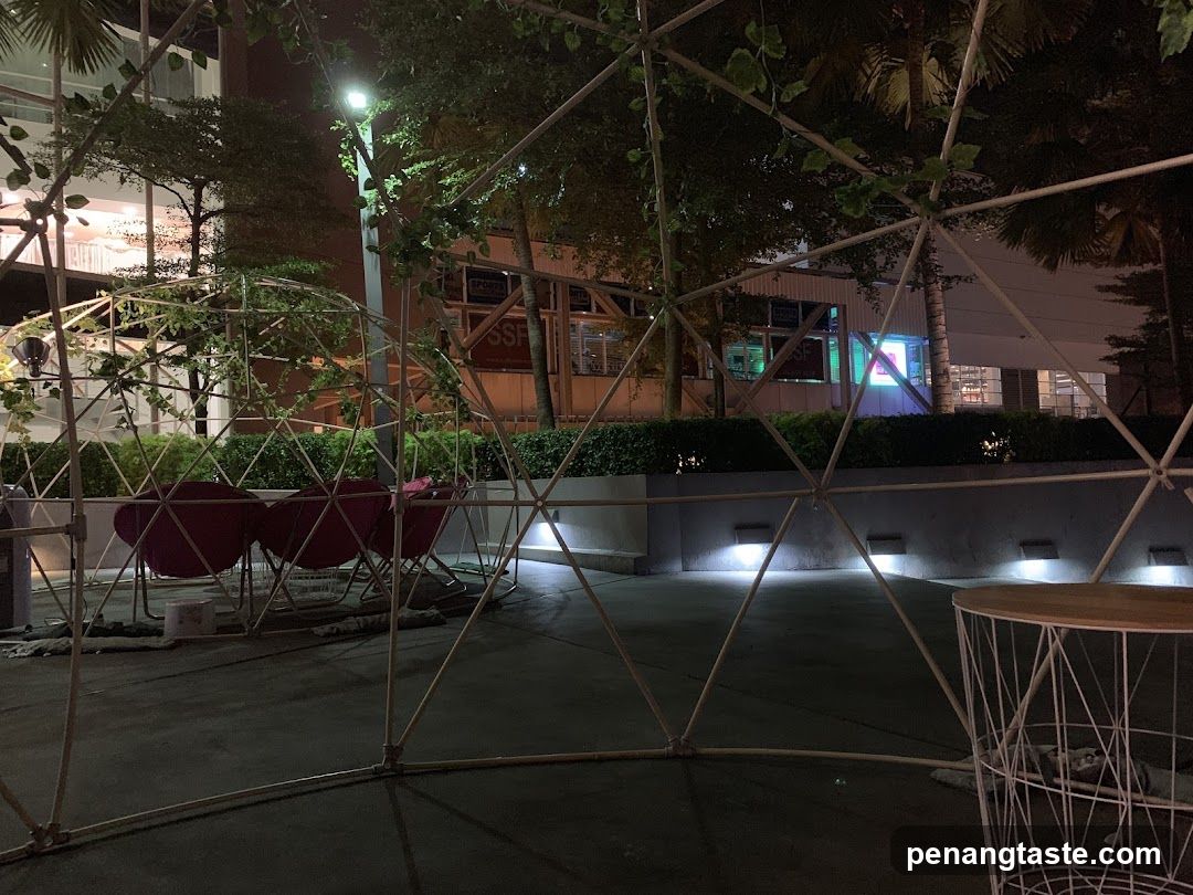 Outdoor seating area with geodesic dome structure
