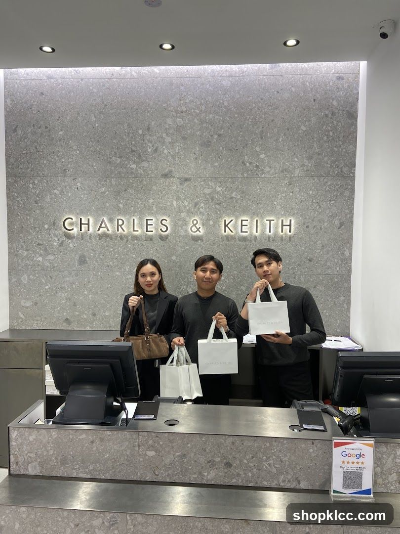 Employees holding shopping bags