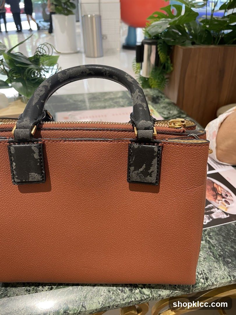 Brown Handbag on Marble Table