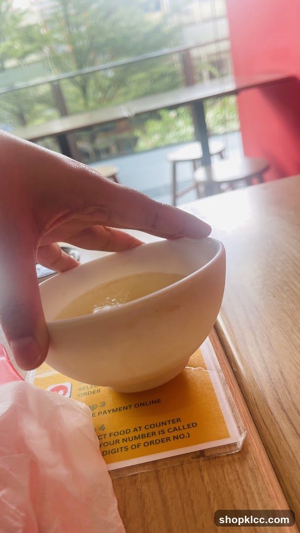Bowl of liquid on a table