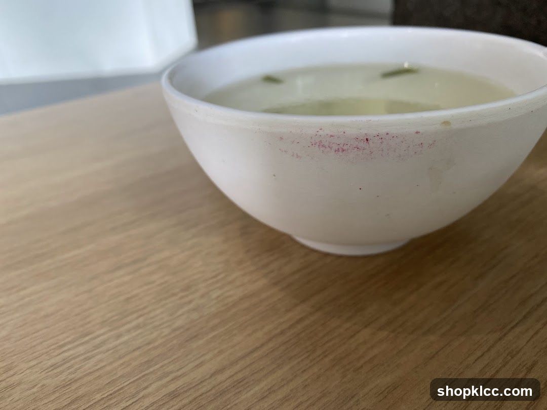 Bowl of soup with lipstick stain