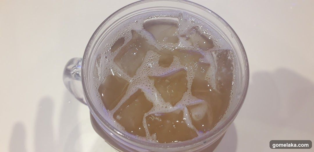 Iced beverage in transparent mug