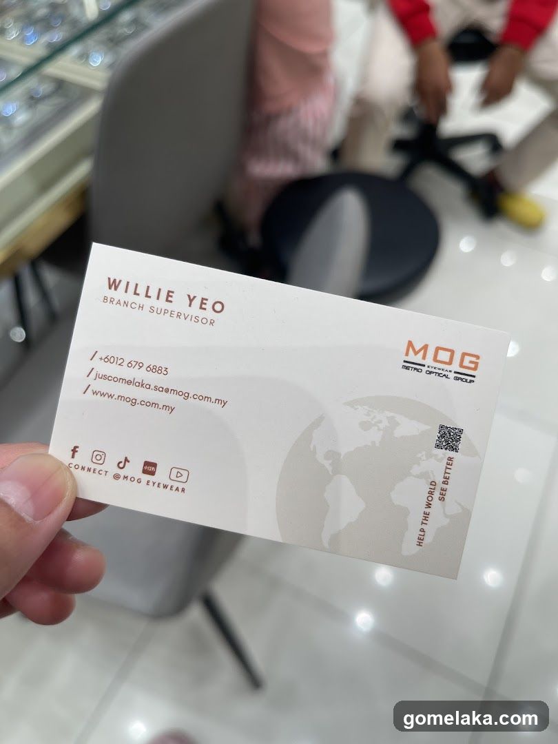Business Card Held in Store Interior