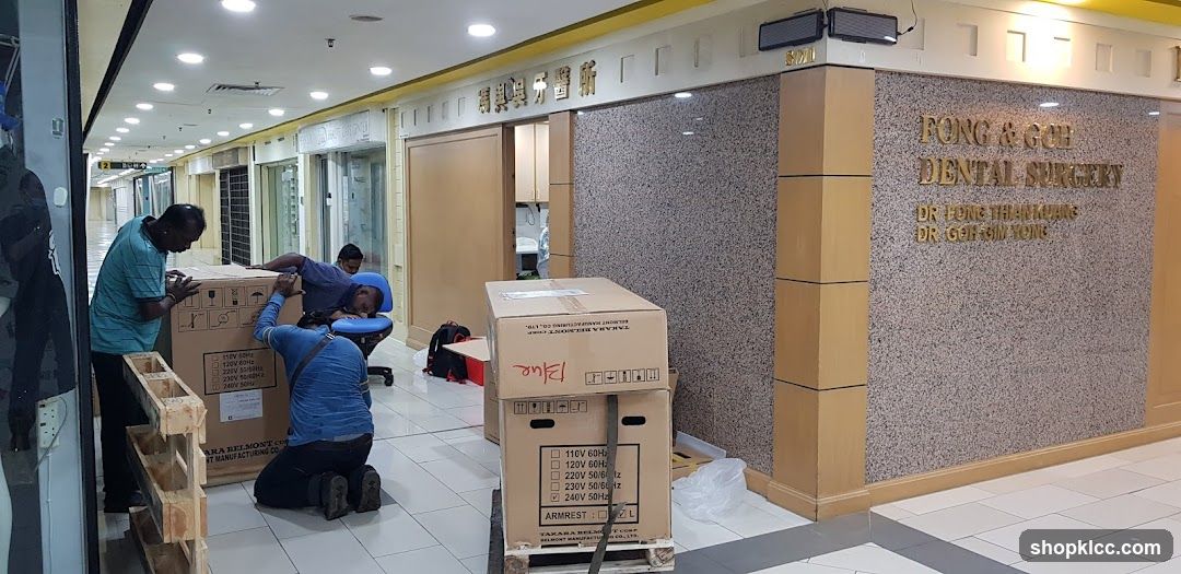 Dental Surgery Storefront with Staff Unpacking Boxes