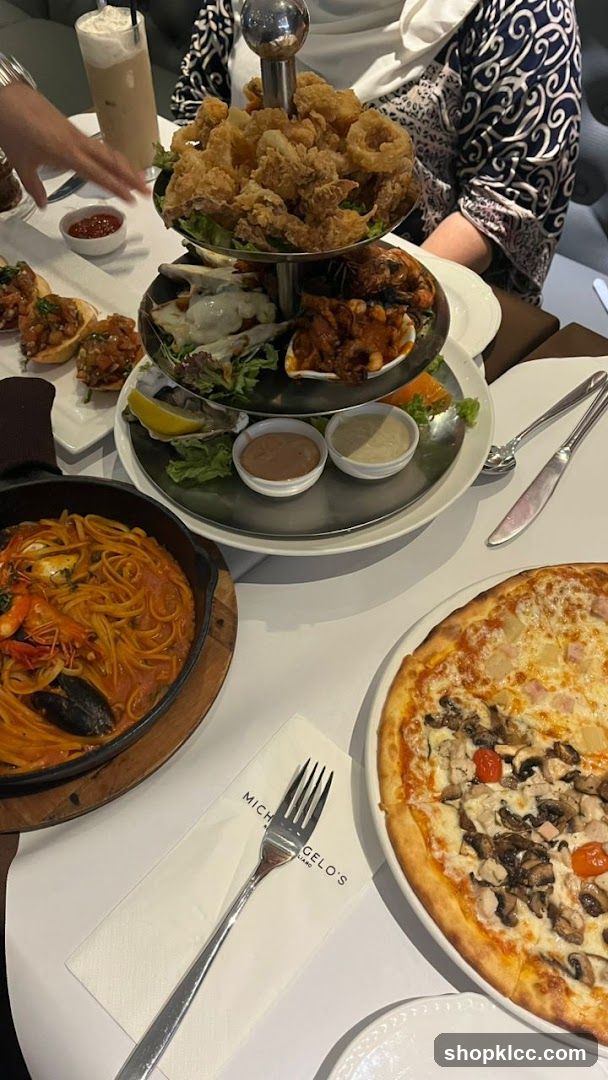 Dining Table with Seafood Platter and Pizza