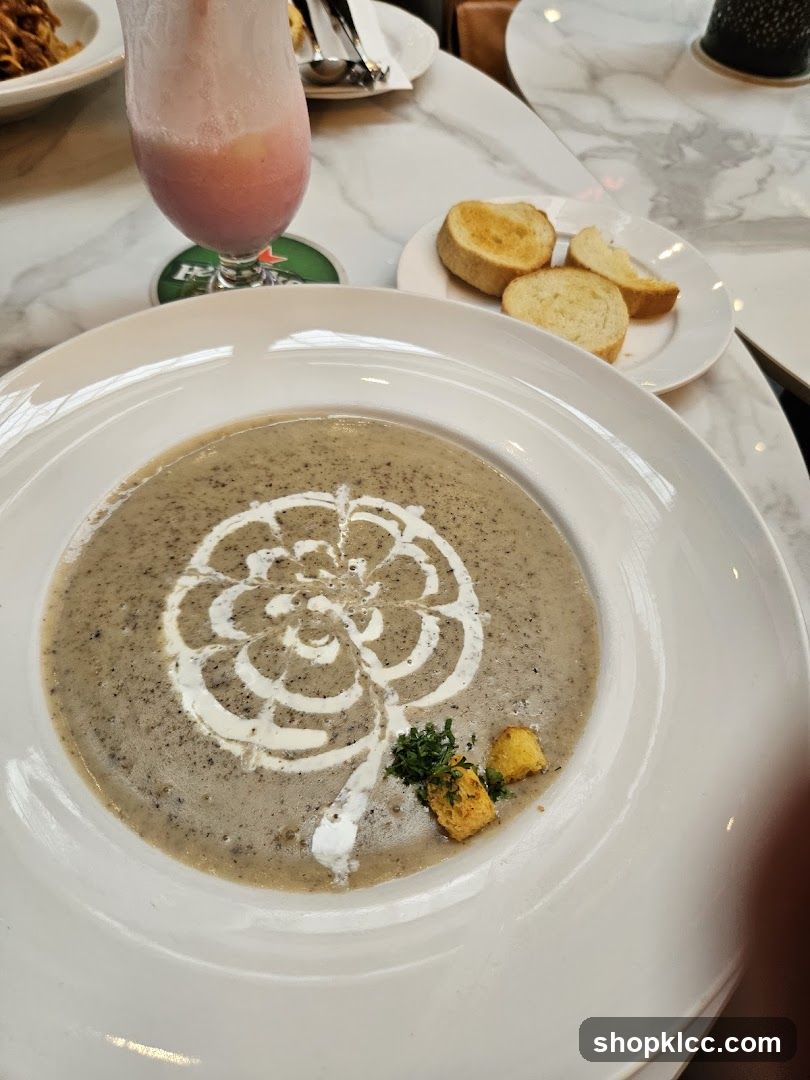 Soup with garnish and bread