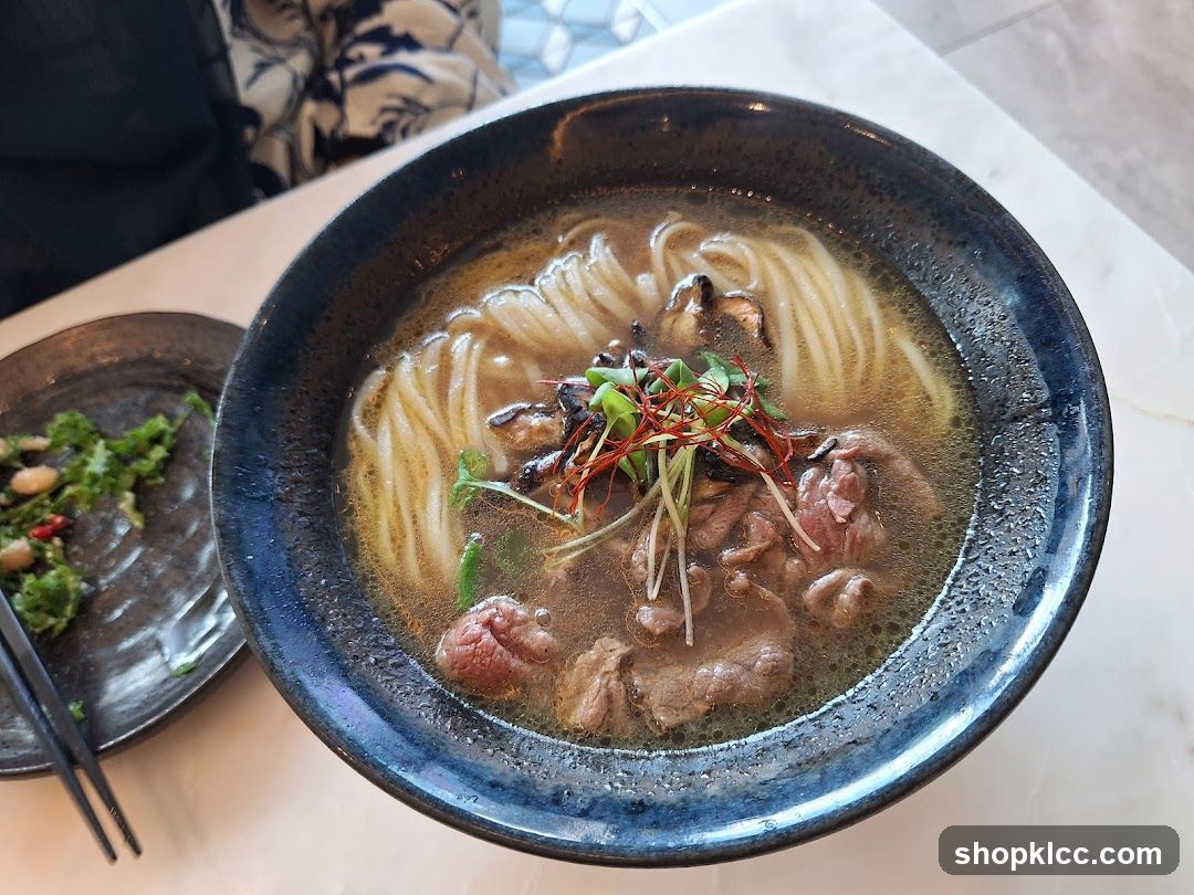 Bowl of Noodle Soup with Meat and Greens