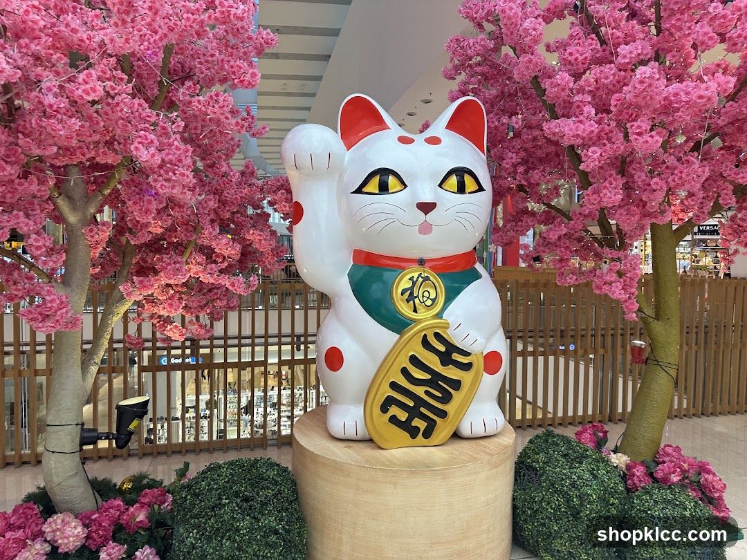 Maneki-neko Statue with Cherry Blossoms