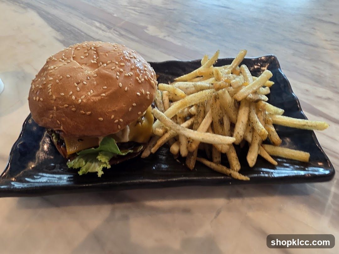 Burger and Fries on Black Plate