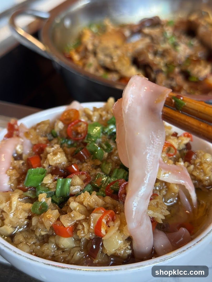 Close-up of a dish with meat and chili peppers