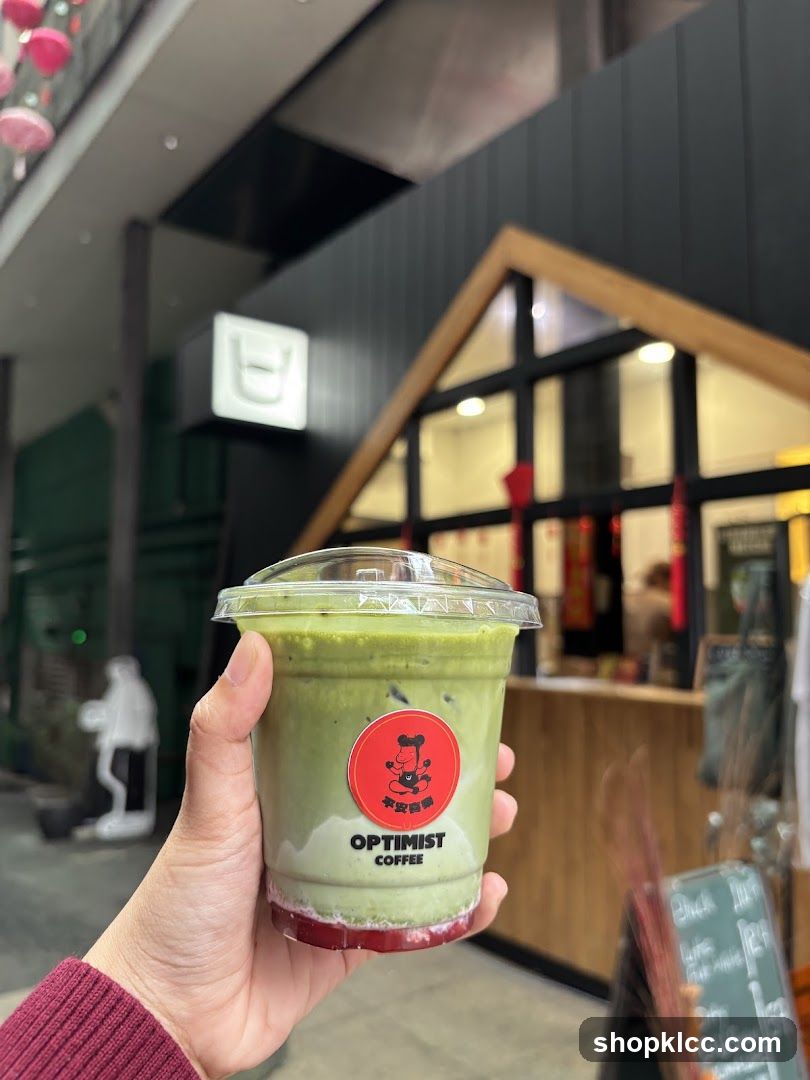 Matcha Drink with Optimist Coffee Logo