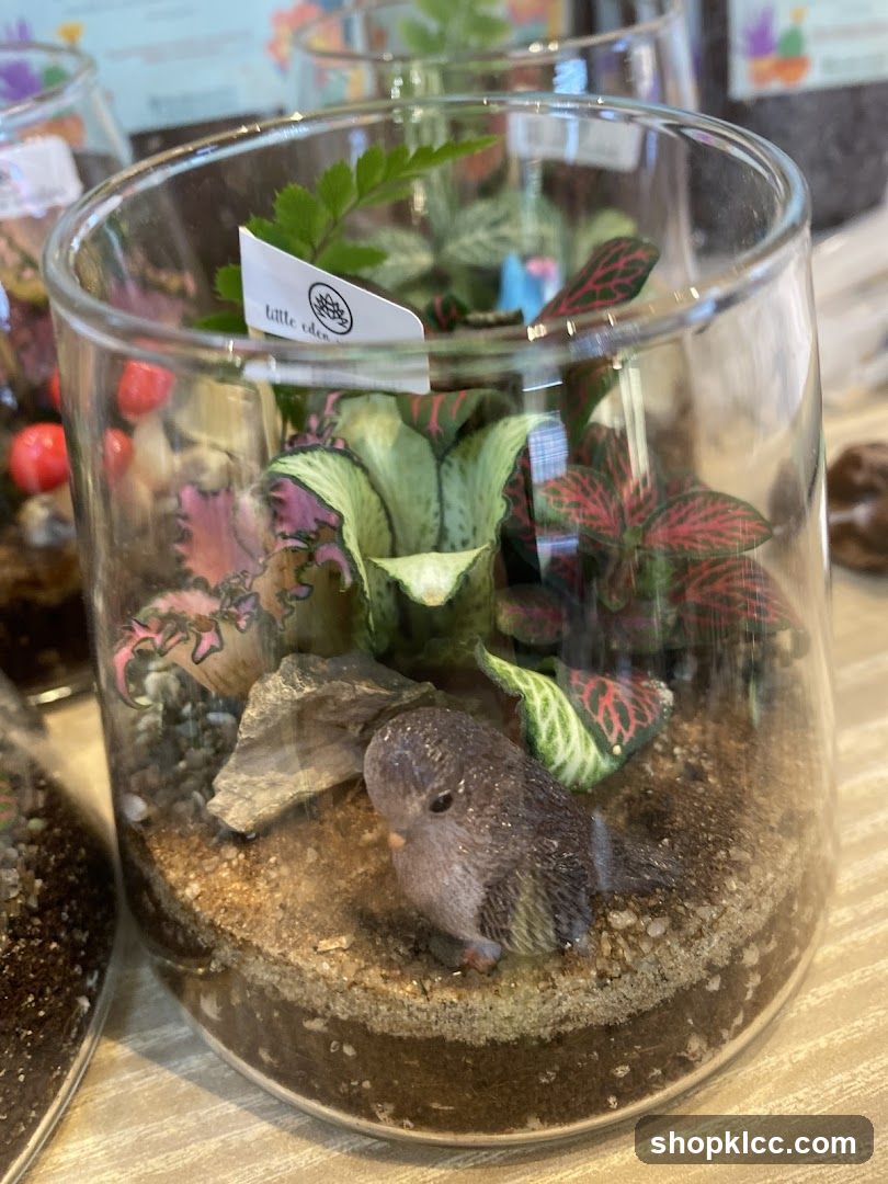 Glass Terrarium with Miniature Bird Figurine