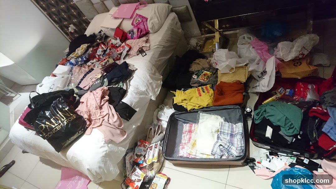 Messy Room with Clothes and Luggage