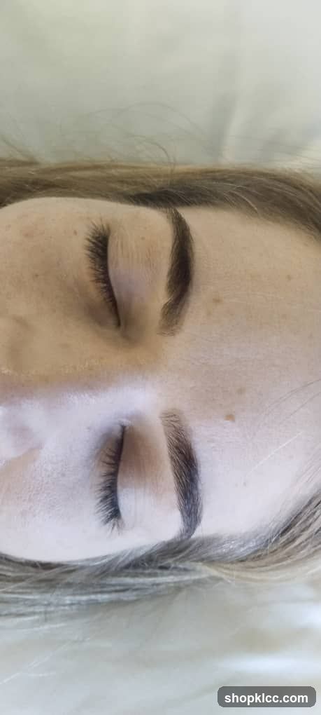 Close-up of a person's face with closed eyes