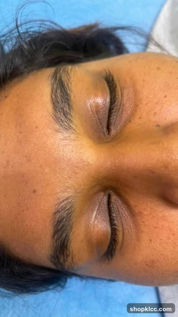 Close-up of a person's face with closed eyes