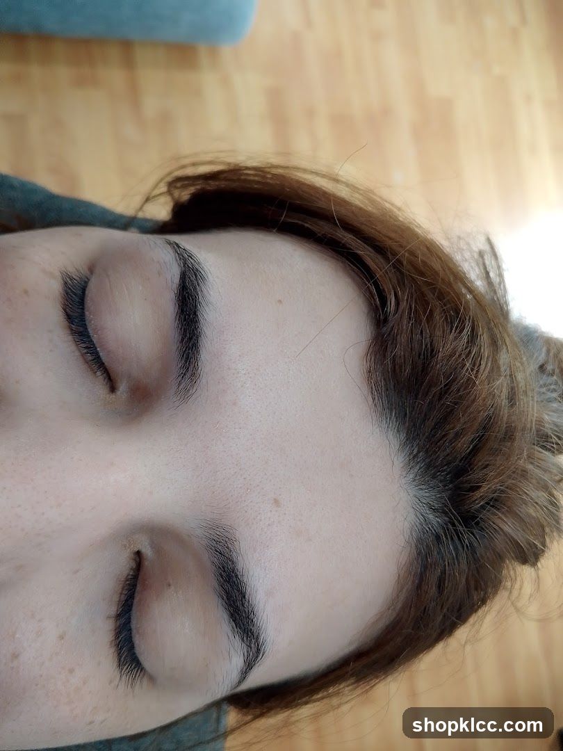 Close-up of a person's face with closed eyes
