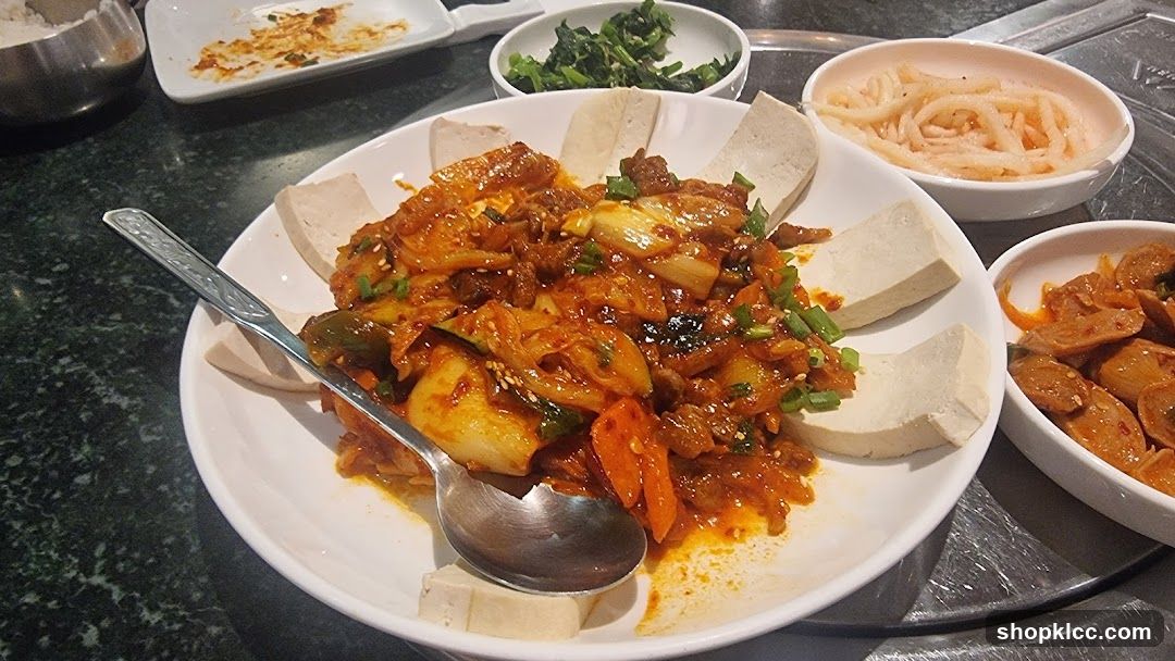 Korean-style stir-fry with tofu and side dishes