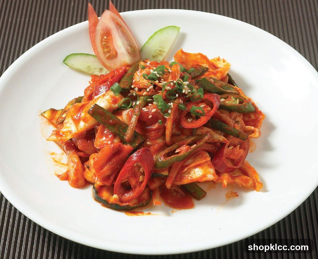 Spicy Vegetable Salad with Tomato and Cucumber Garnish