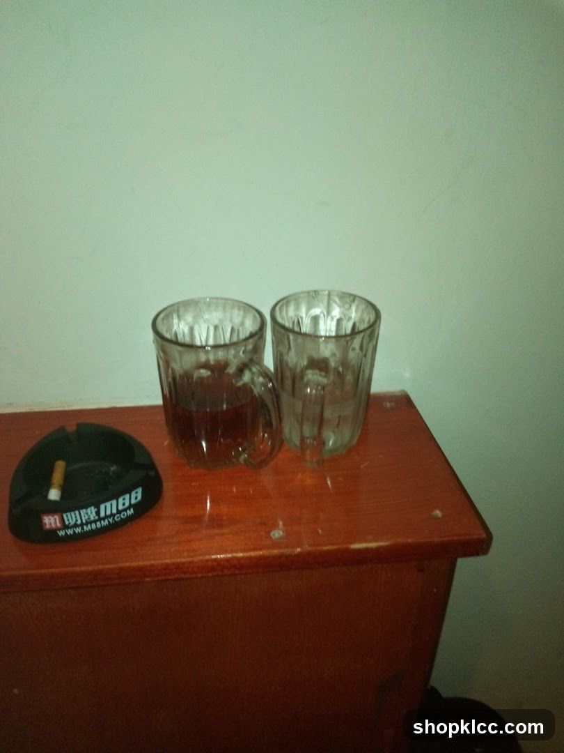 Cup and Ashtray on Wooden Surface
