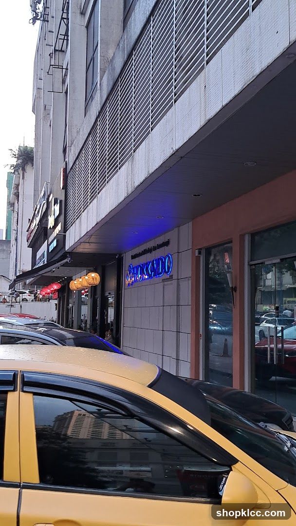 Street View with Yellow Taxi and Storefronts