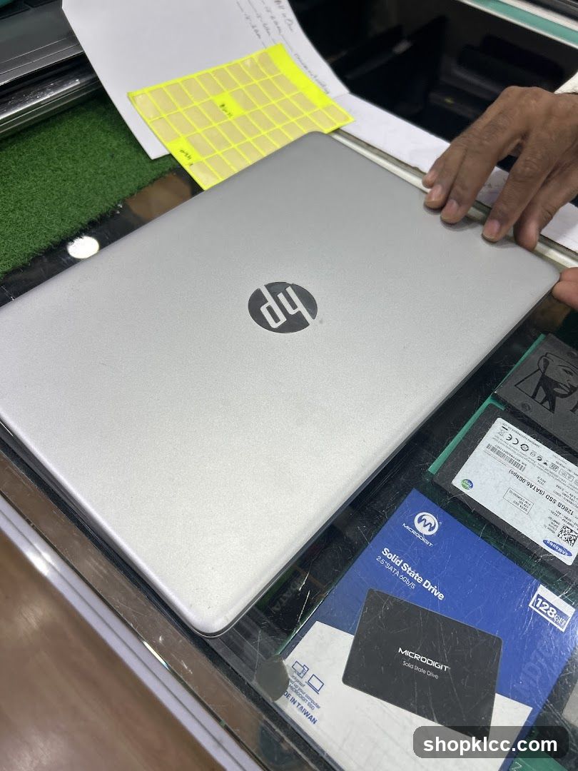 HP Laptop on Counter with Accessories
