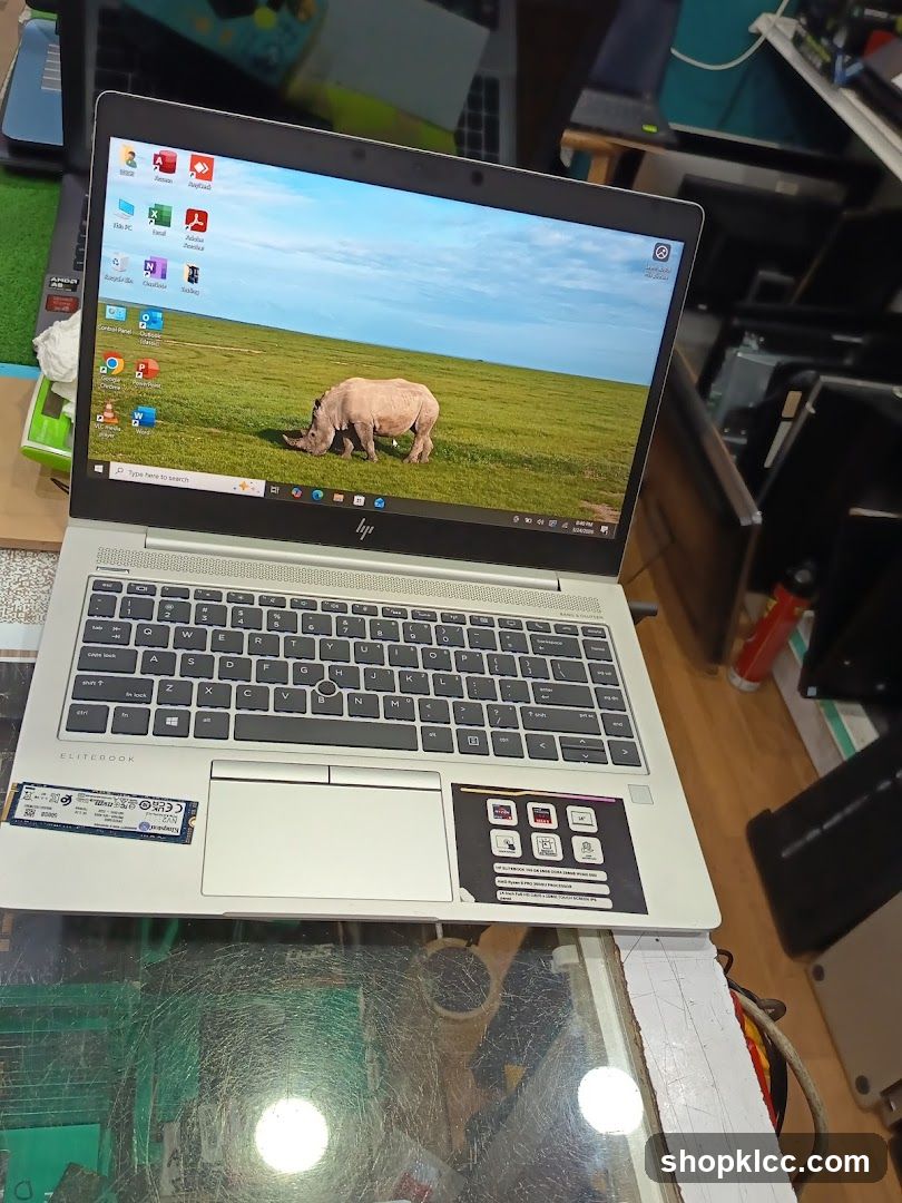 HP EliteBook Laptop on Glass Table