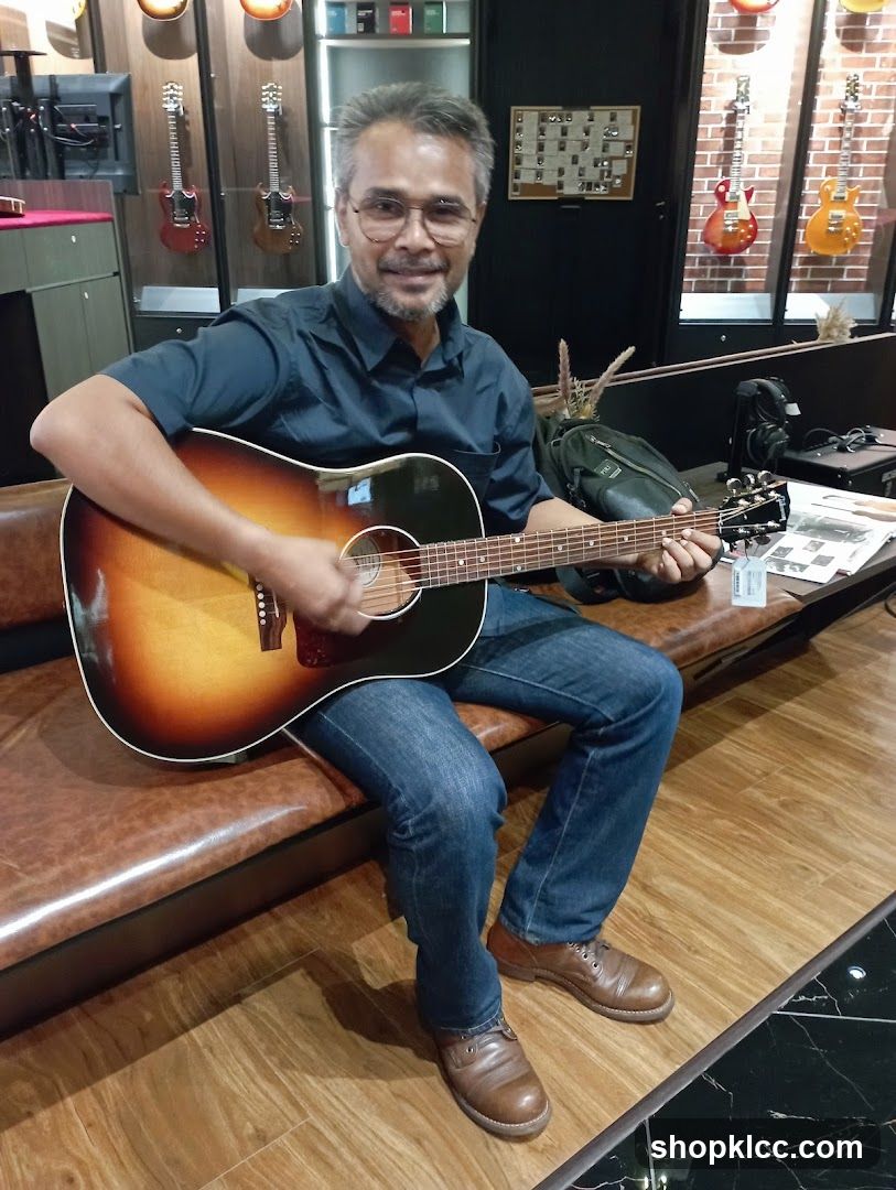 Man playing guitar in a store