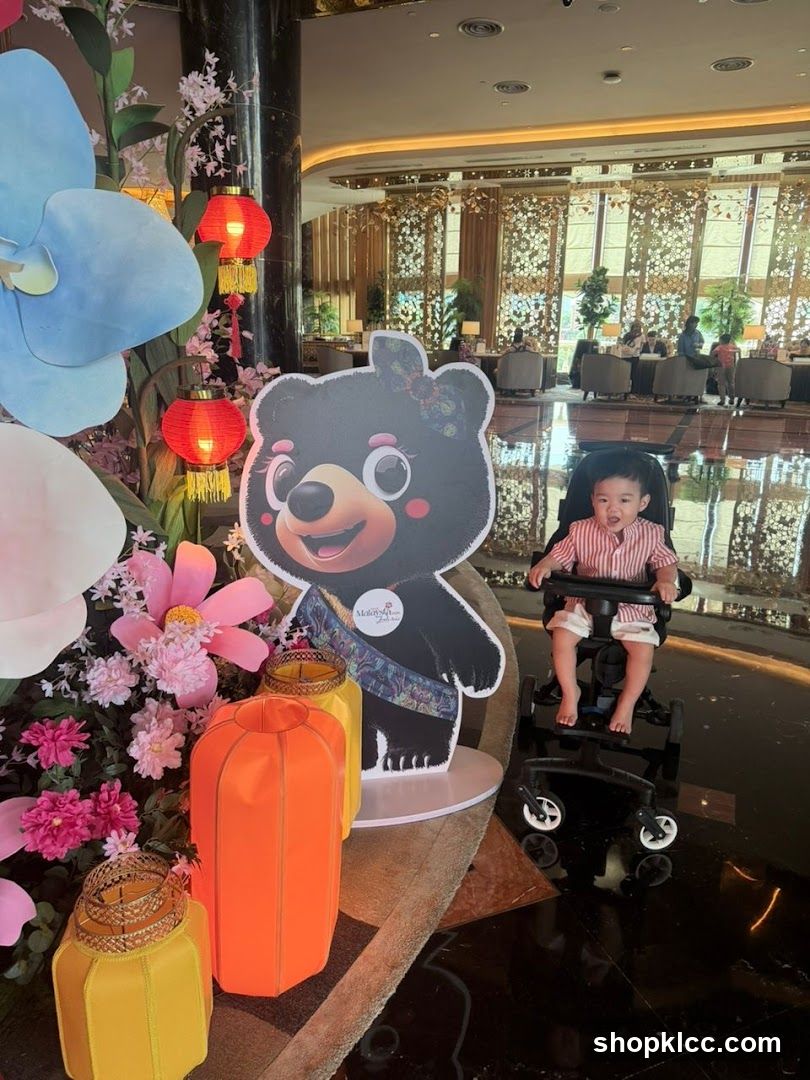 Child in Wheelchair at Hotel Lobby with Decorative Display