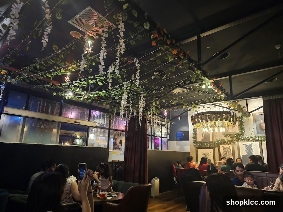 Interior of a cozy restaurant or cafe with decorative hanging plants and warm lighting.