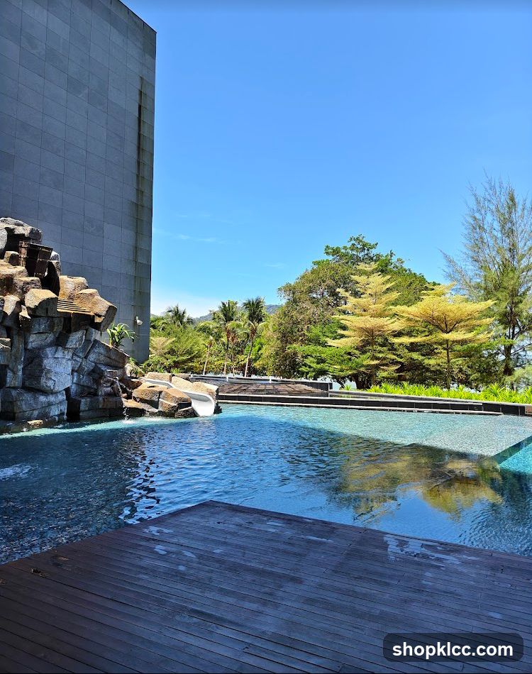 Poolside View with Rockwork and Building Facade