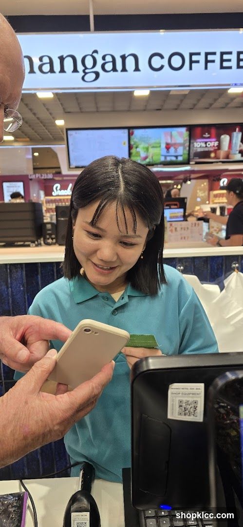Customer at Coffee Shop Counter