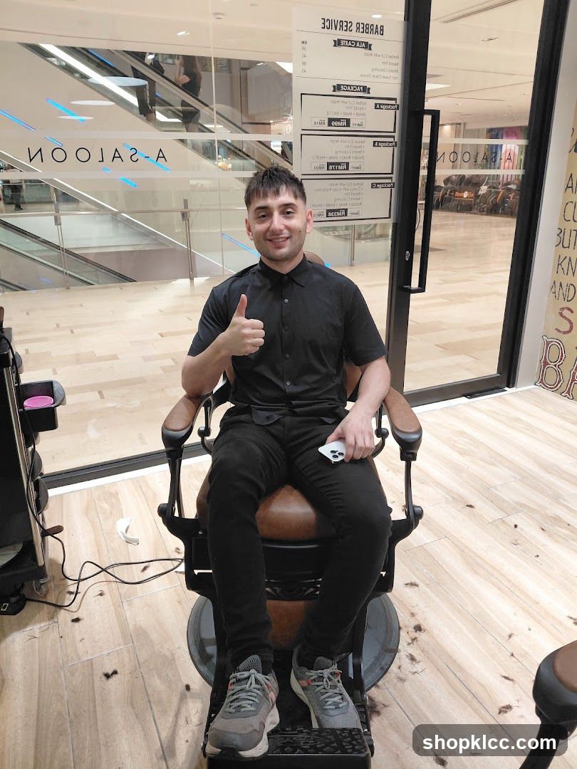 Barber Shop Interior with Staff Member
