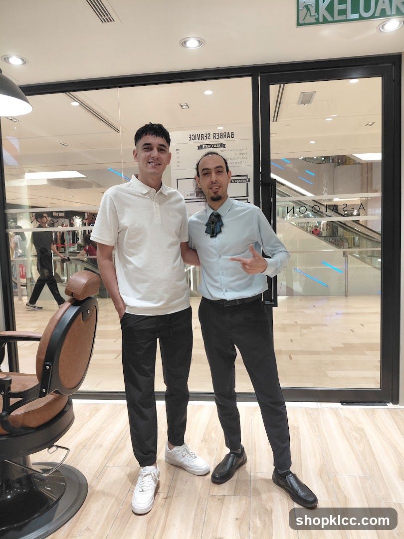 Barbershop Interior with Staff and Customer