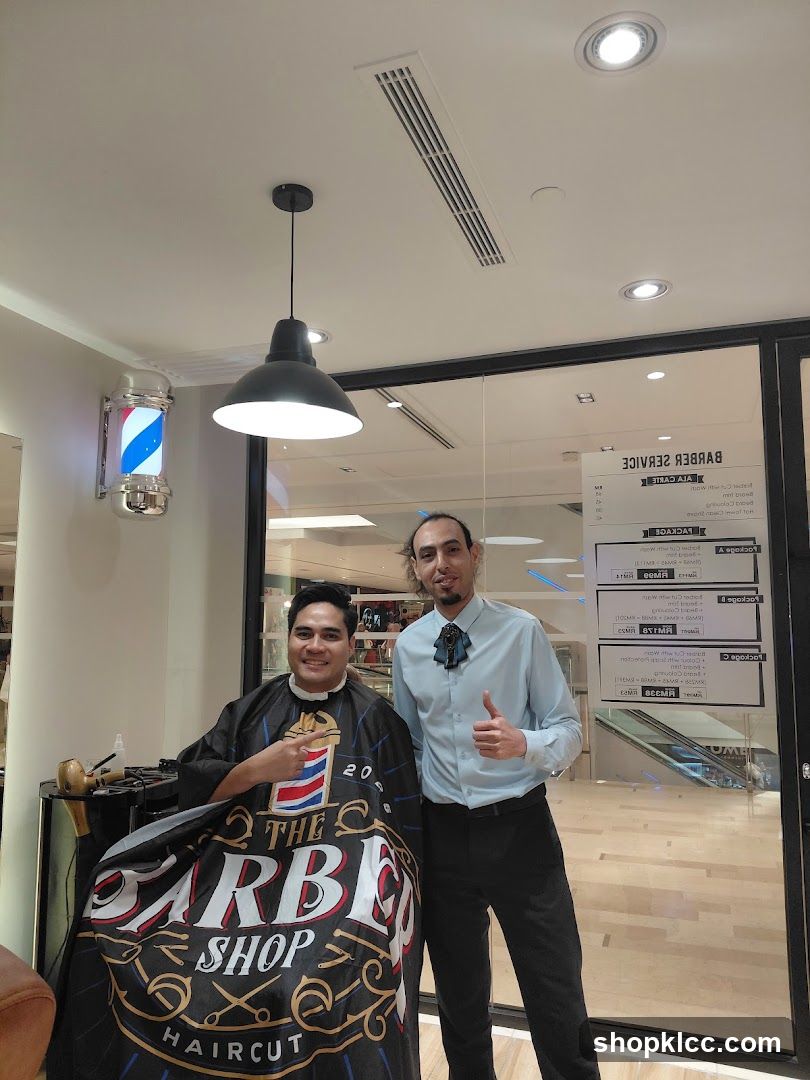 Barbershop Interior with Staff and Customer