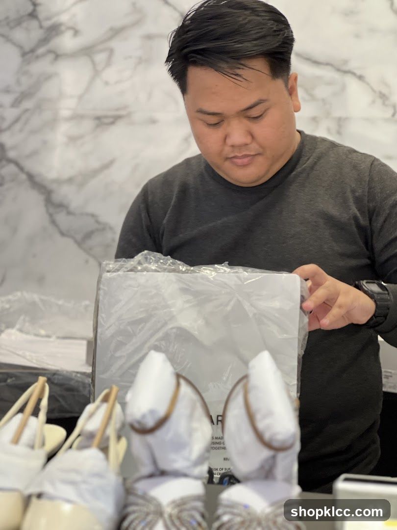 Man Inspecting Shoes in Store