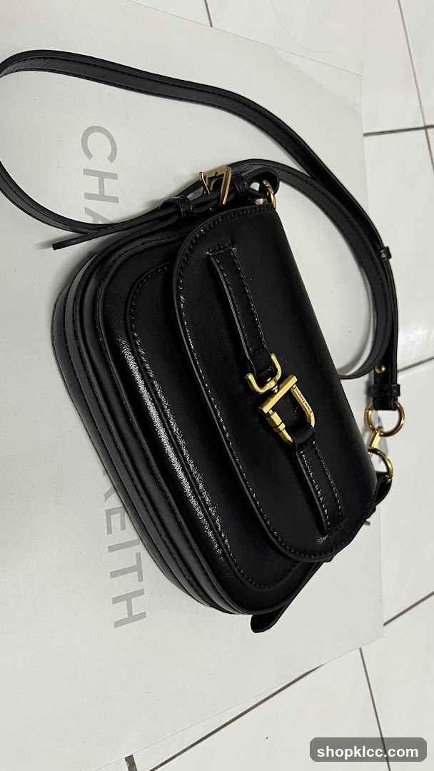 Black Leather Crossbody Bag on Brand Box