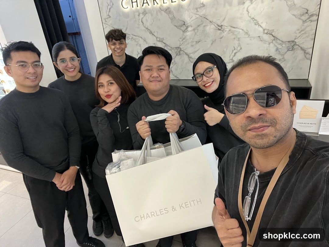 Group with shopping bags at Charles & Keith store