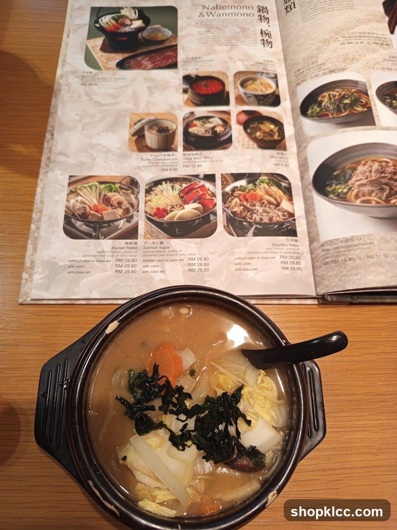 Soup Bowl with Menu in Background