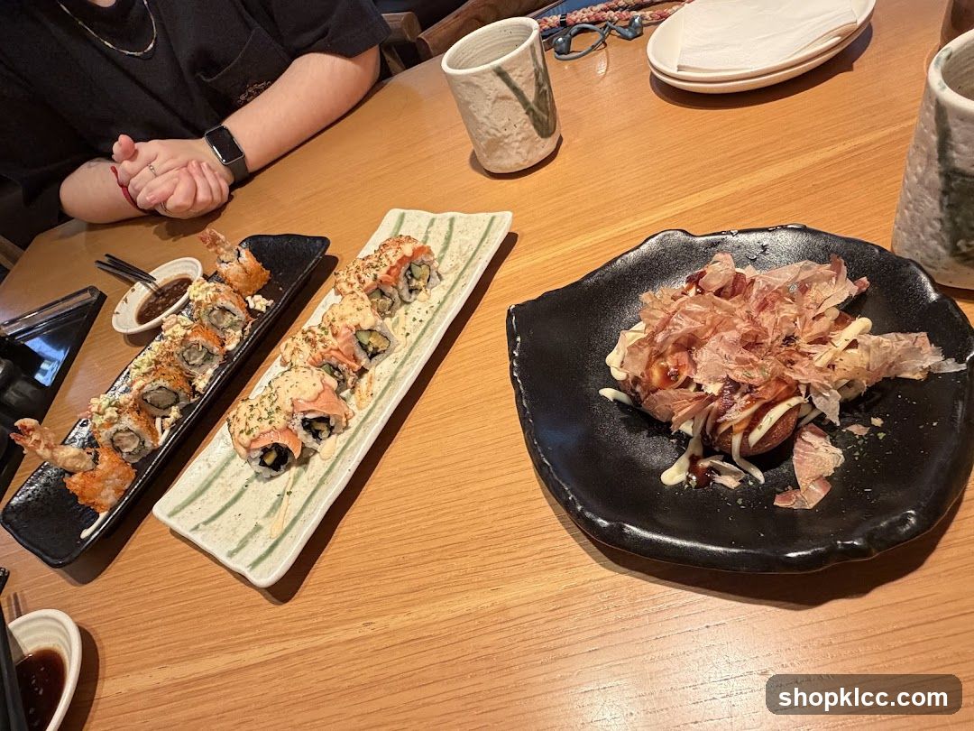 Sushi and Okonomiyaki at a Restaurant Table