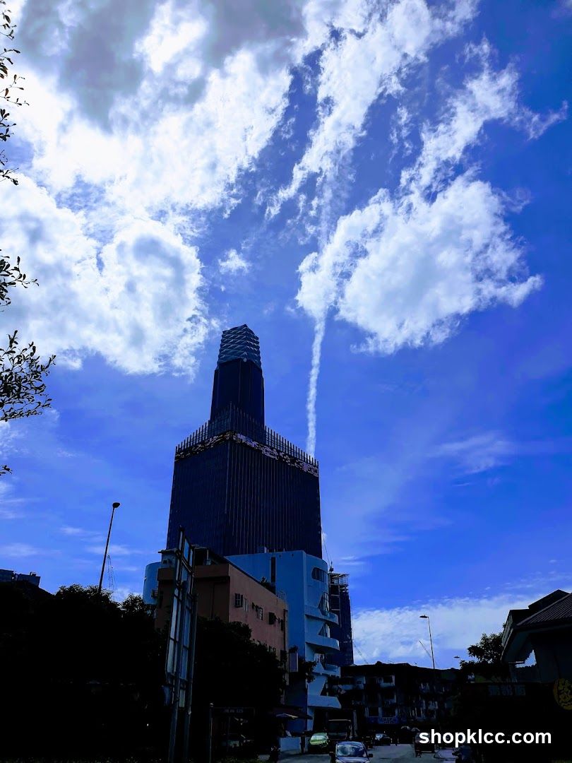 Skyscraper under construction against blue sky