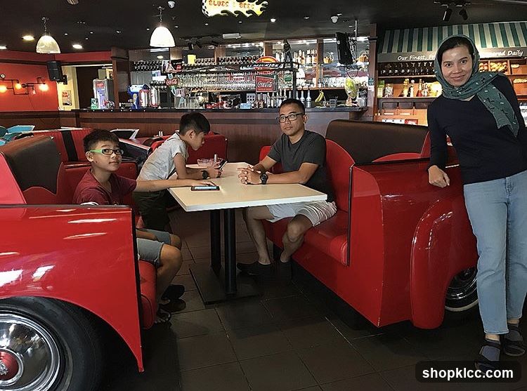 Family dining in a retro-themed restaurant