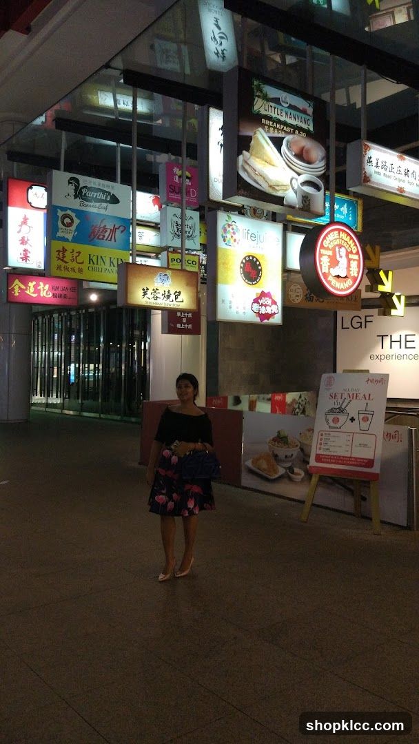 Street Scene with Signs and Woman