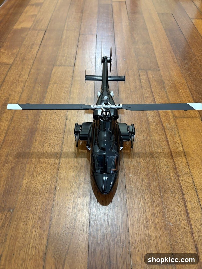 Black Helicopter Model on Wooden Floor