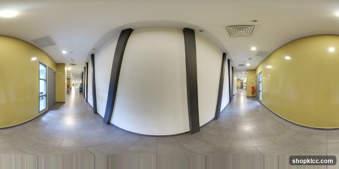 Interior Hallway with Yellow Walls and White Columns