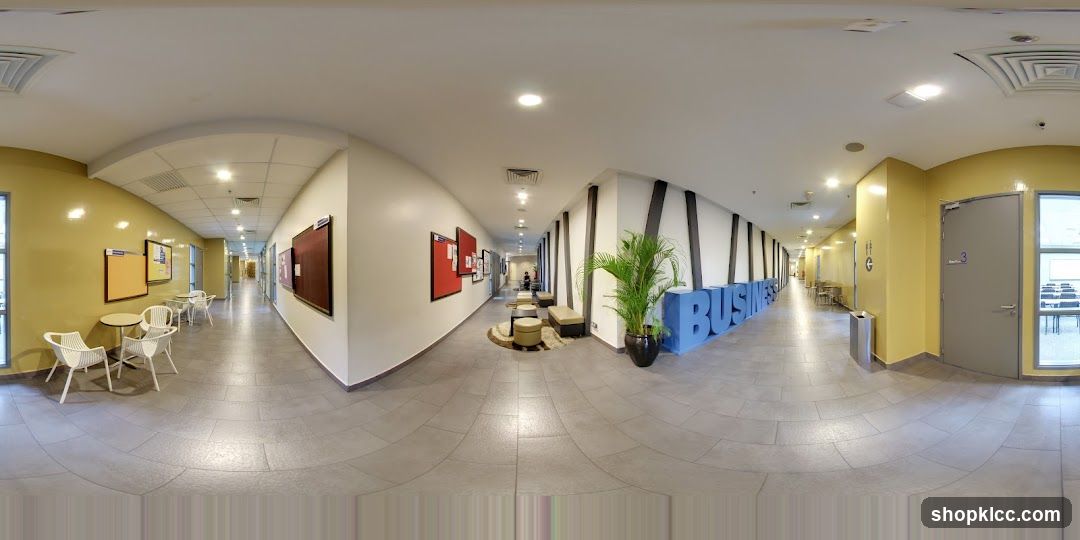 Interior Hallway with Bulletin Boards and Seating Area