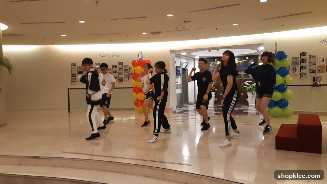 Group Dance Performance in Mall Lobby