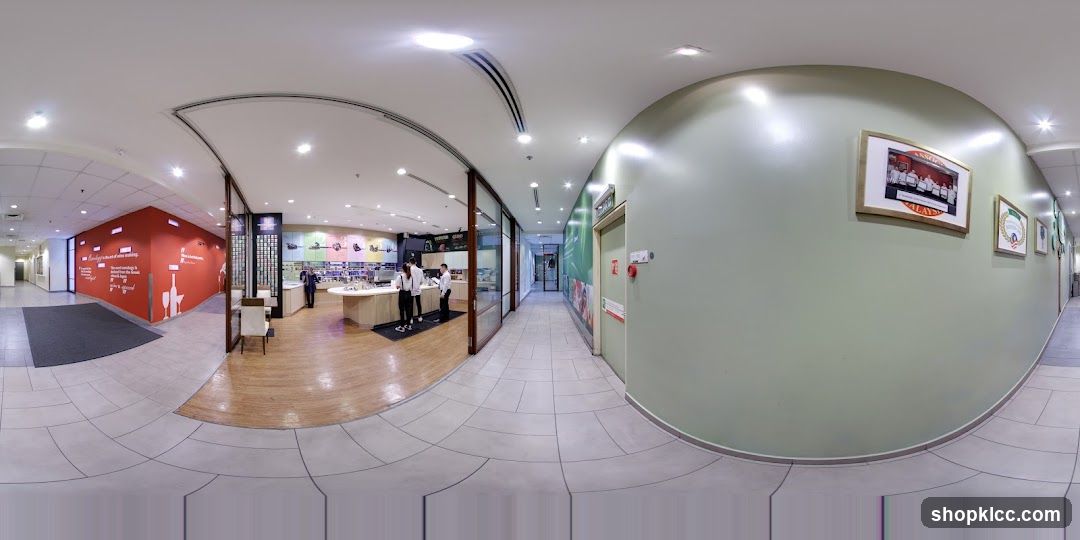 Interior of a retail store with staff at counter