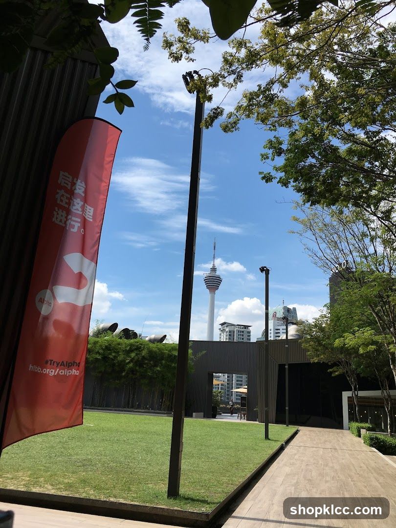Outdoor area with a flag and tower in the background