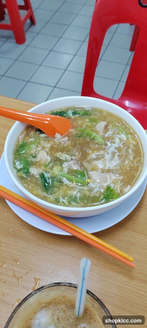 Bowl of Soup with Vegetables and Meat